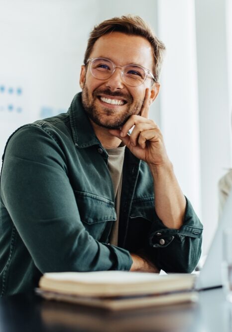Business,Man,Listening,To,A,Discussion,During,A,Meeting,In